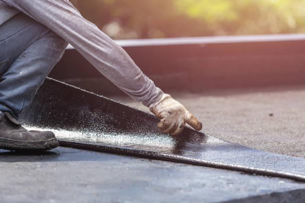 Professional Basement Waterproofing technician working in Woodstock, VA